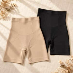 Neutral shapewear arranged on ivory linen