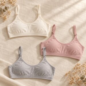White, rose and grey starter bras on linen